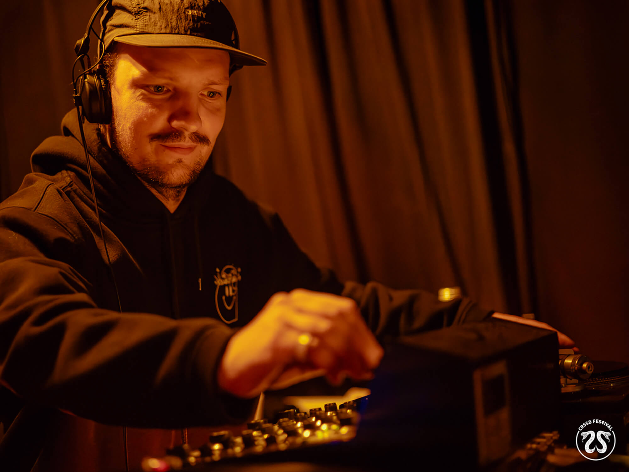 DJ spinning vinyl at Chapter One Records’ booth at the CRSSD Festival, photo by Izzy Hassan