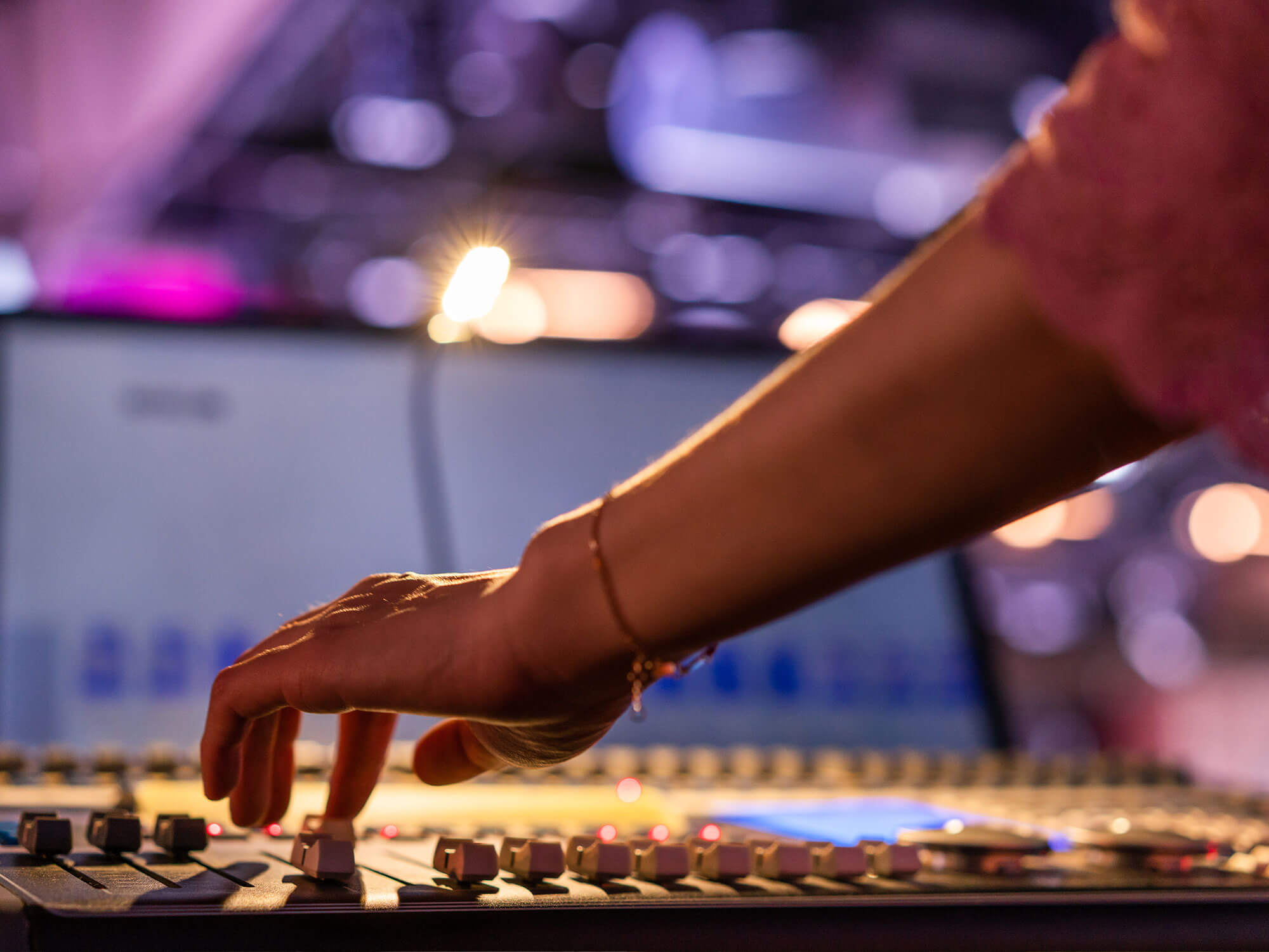 Mix engineer working at a sound desk